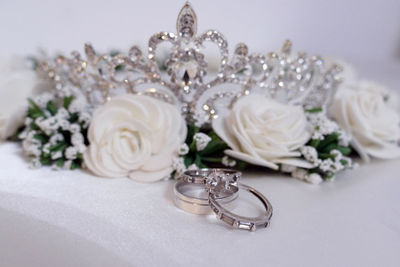 Close-up of wedding rings on table