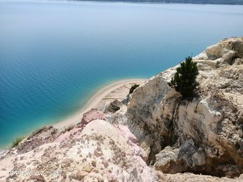 High angle view of rocks on beach against sky