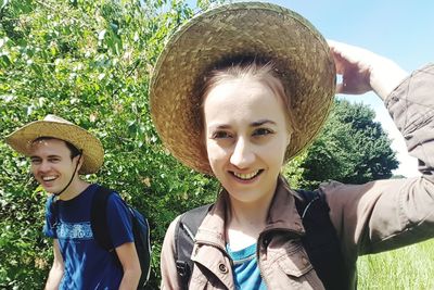 Portrait of smiling young woman in park