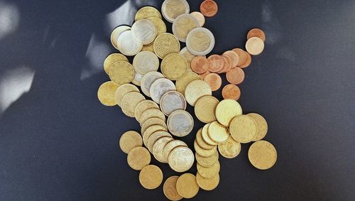 High angle view of coins on table