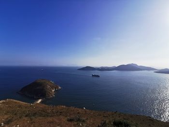 Scenic view of sea against blue sky