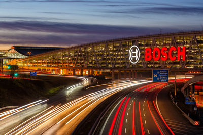 Light trails on road in city at night