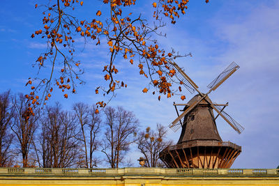 Traditional windmill against sky