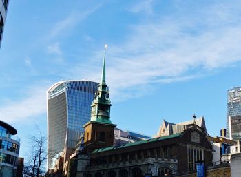 Low angle view of modern building against blue sky