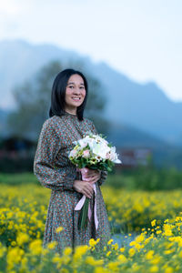 Woman standing on field