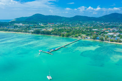 Aerial view drone shot of long tail boat at rawai beach,phuket t