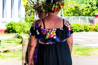 Rear view of woman standing outdoors