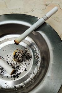 Close-up of cigarette on table