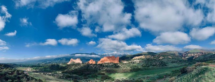 Panoramic shot of building and mountains against sky