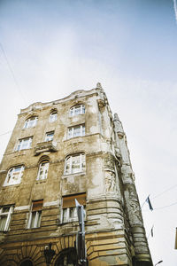 Low angle view of old building against sky