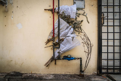 Abandoned clothes on wall in old building