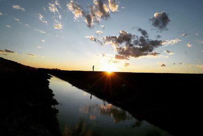 Scenic view of landscape against sky during sunset