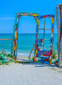 Scenic view of sea against clear blue sky