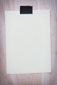 High angle view of white paper on table