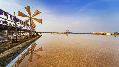 Tredition windmill on salt lake farm in thailand