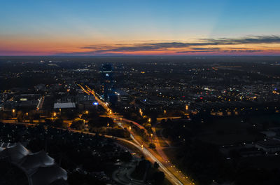 High angle view of illuminated cityscape at night