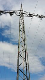 Low angle view of metal structure against sky