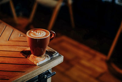 Close-up of coffee cup on table