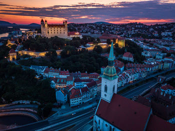 High angle view of buildings in city at night