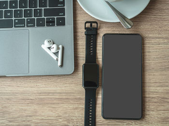 High angle view of mobile phone on table