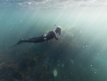 Man swimming in sea