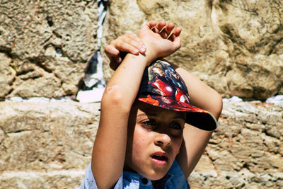 Portrait of boy on rock