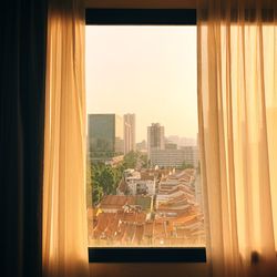 Buildings seen through glass window