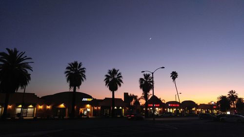 View of illuminated street light against sky at dusk