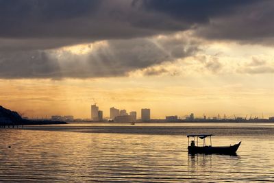 Silhouette boat sailing in sea