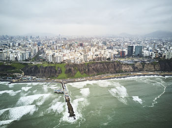 Aerial view of cityscape against sky