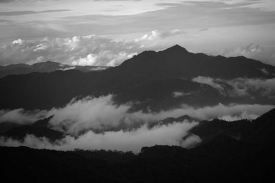 Scenic view of silhouette mountains against sky during sunset