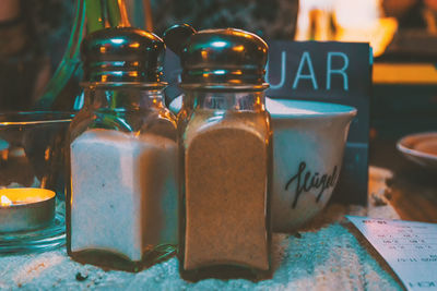 Close-up of glass jar on table at cafe