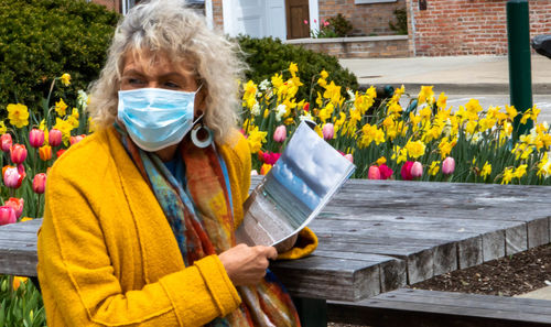 Portrait of woman holding flowers