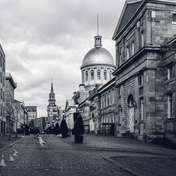 People walking on street in city