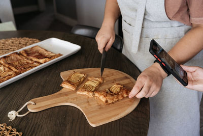 Midsection of woman preparing food