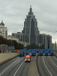 Skyscrapers against cloudy sky