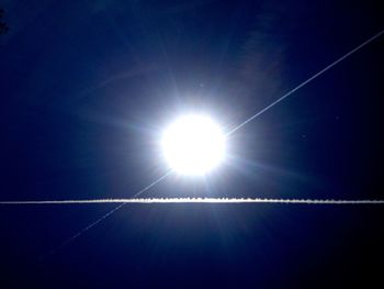 Low angle view of vapor trails in sky