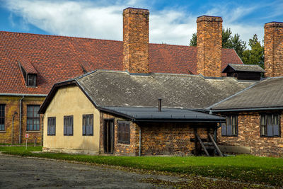 Houses on field against sky