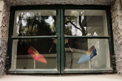 Close-up of glass window on wall