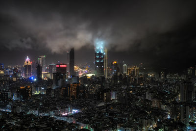 Illuminated buildings in city at night