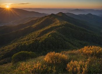 Scenic view of mountains against sky during sunset