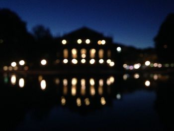 Defocused image of illuminated city at night