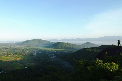 Scenic view of mountains against clear blue sky