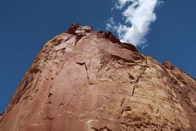 Low angle view of rock formation against sky