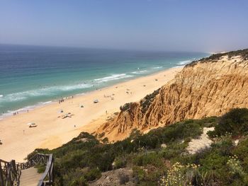 Scenic view of beach against clear sky