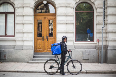 Man riding bicycle on building