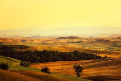 Scenic view of landscape against sky during sunset