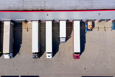 High angle view of trucks parked by building