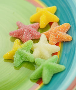 High angle view of multi colored candies on table