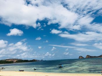 Scenic view of sea against blue sky